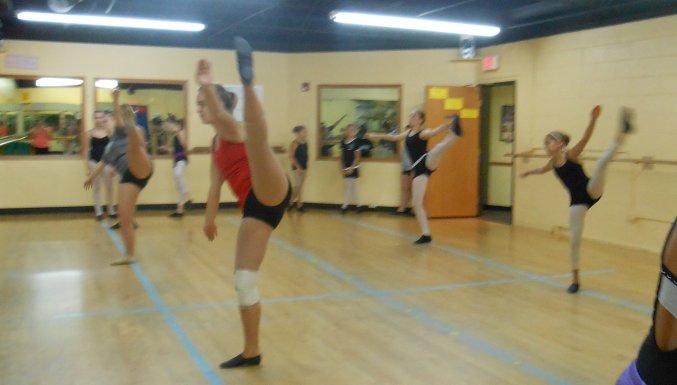 Kendall performs a side tilt at AMA's Summer Intensive Workshop in Des Plaines