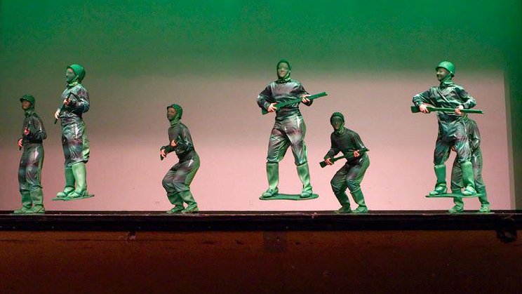 AMA's Army Men dance with cut-out boards attached to their feet.