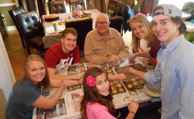 Grandpa helps us make cookies.