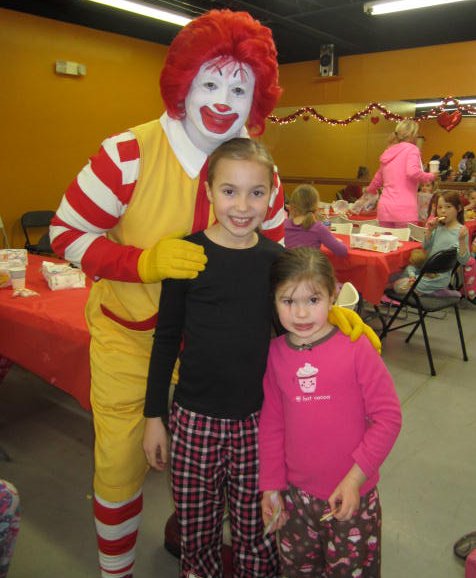 Ronald poses with AMA students.