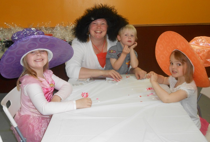 Wearing our lovely hats at the Tea Party.
