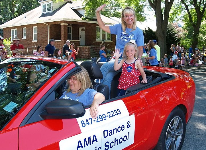 AMA director Ann Marie Frank waves in the parade