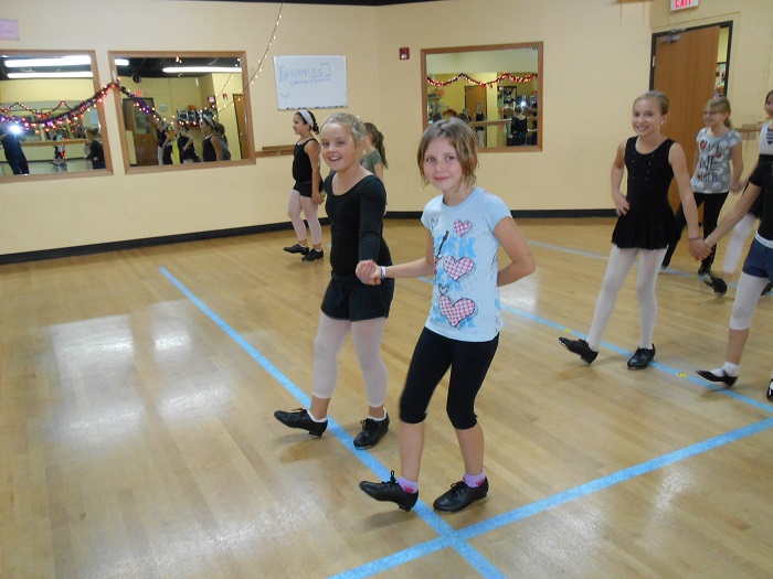 Friends dance together at AMA Dance and Music School in Des Plaines