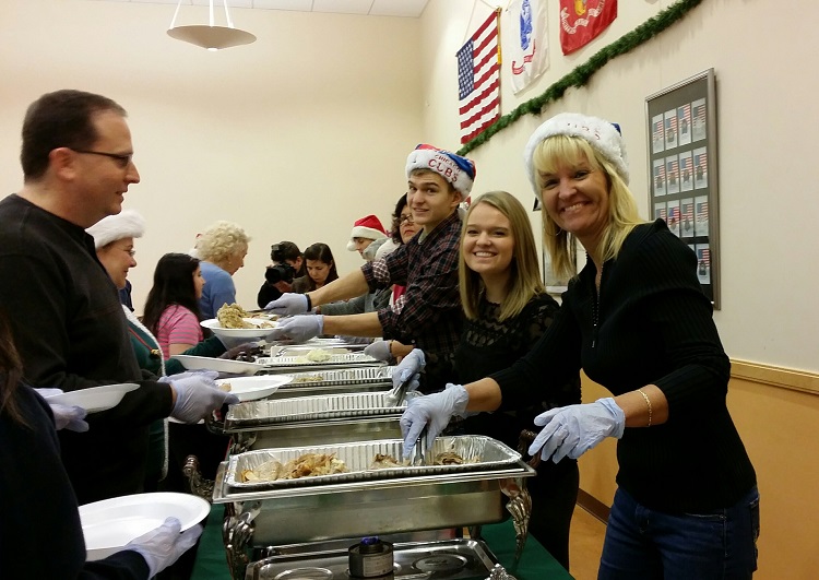 Ann Marie Frank and family volunteers on Christmas Day at the senior center
