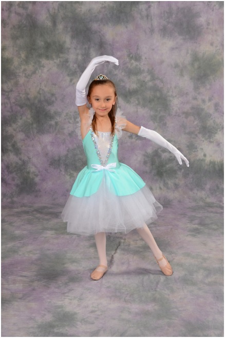A dancing student poses for a photo at AMA Dance and Music School